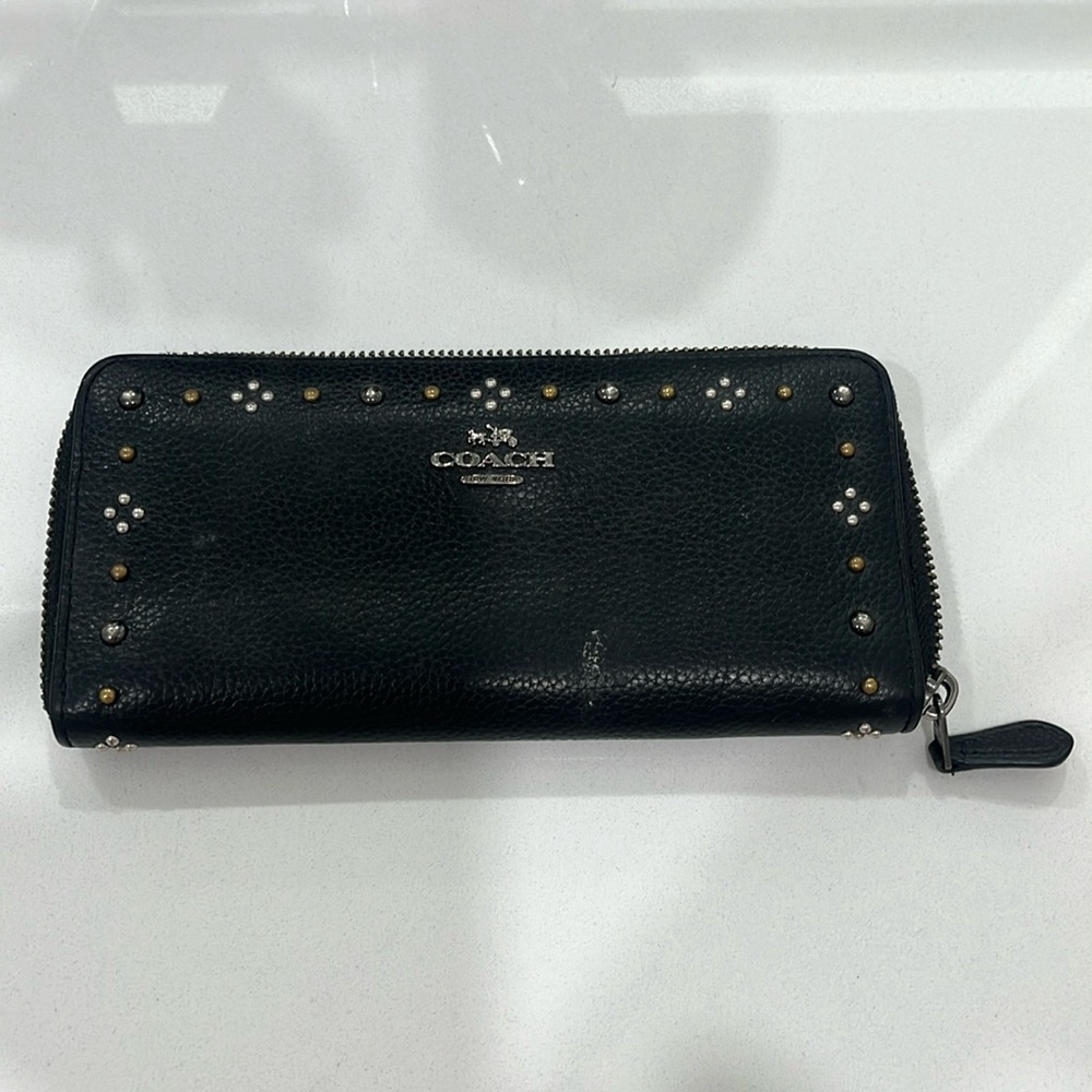 Black Coach wallet with pretty detailing